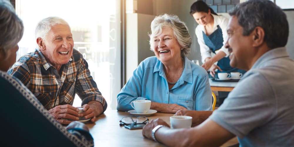 Residents drinking coffee at a Ridgeline Management Company senior living property