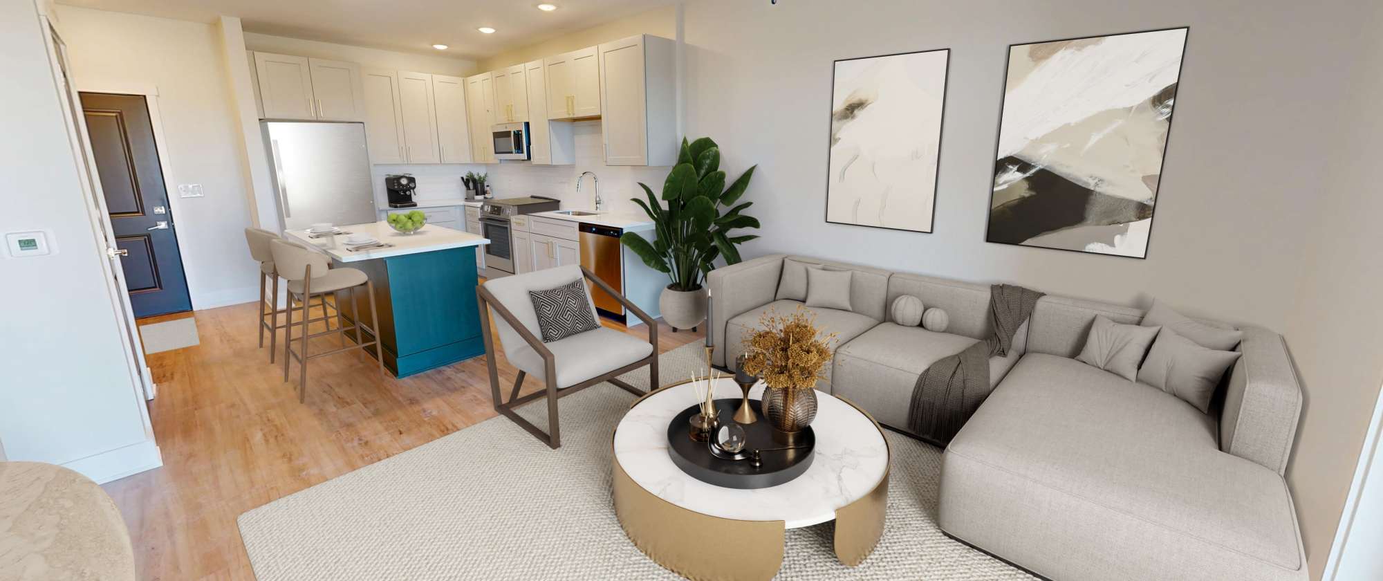 Comfortable sofa in the living room with a view of the kitchen at Factory 52 Apartments in Norwood, Ohio