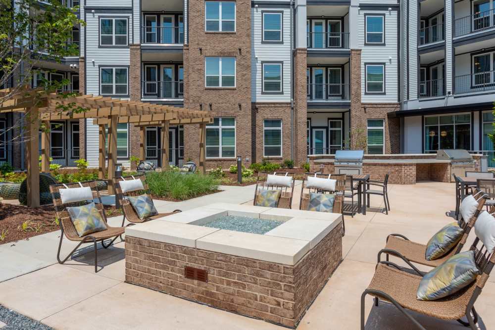 Outdoor seating area with fire pit at District at 54 in Raleigh,North Carolina