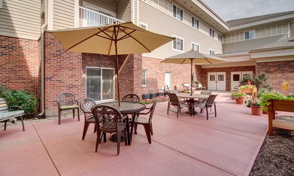 Spacious outdoor patio with seating at Randall Residence of McHenry in McHenry, Illinois