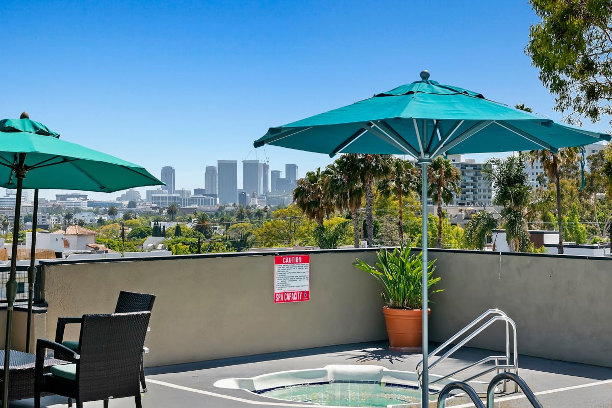 Hot tub with patio and lounge chairs at Ascent, West Hollywood, California