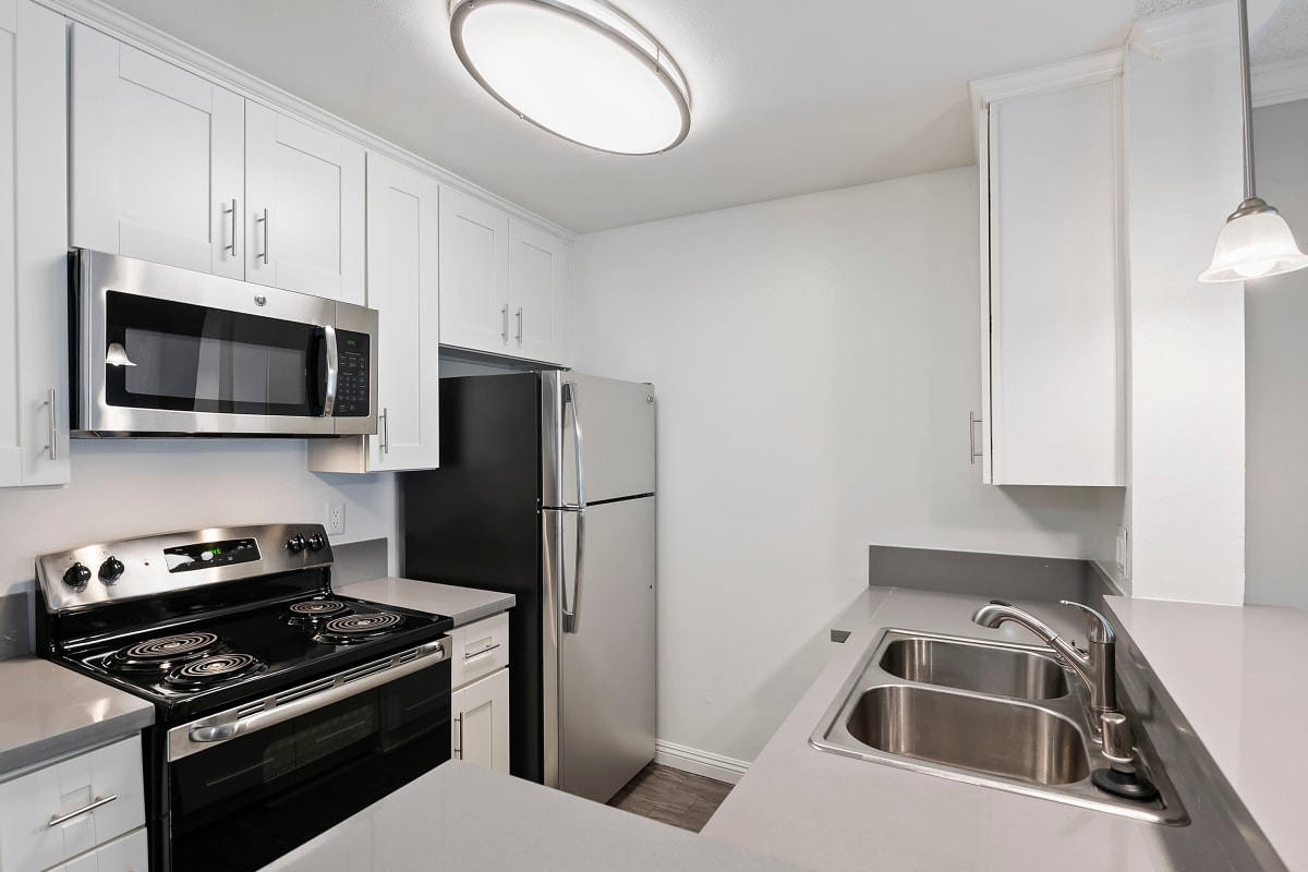 Kitchen with stainless-steel appliances at Westside Terrace, Los Angeles, California