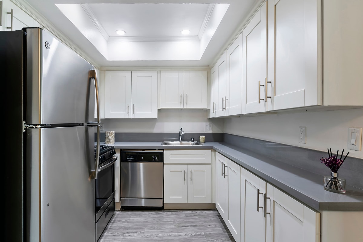 Kitchen with granite counter tops at Kingsley Drive Apartments, Los Angeles, California