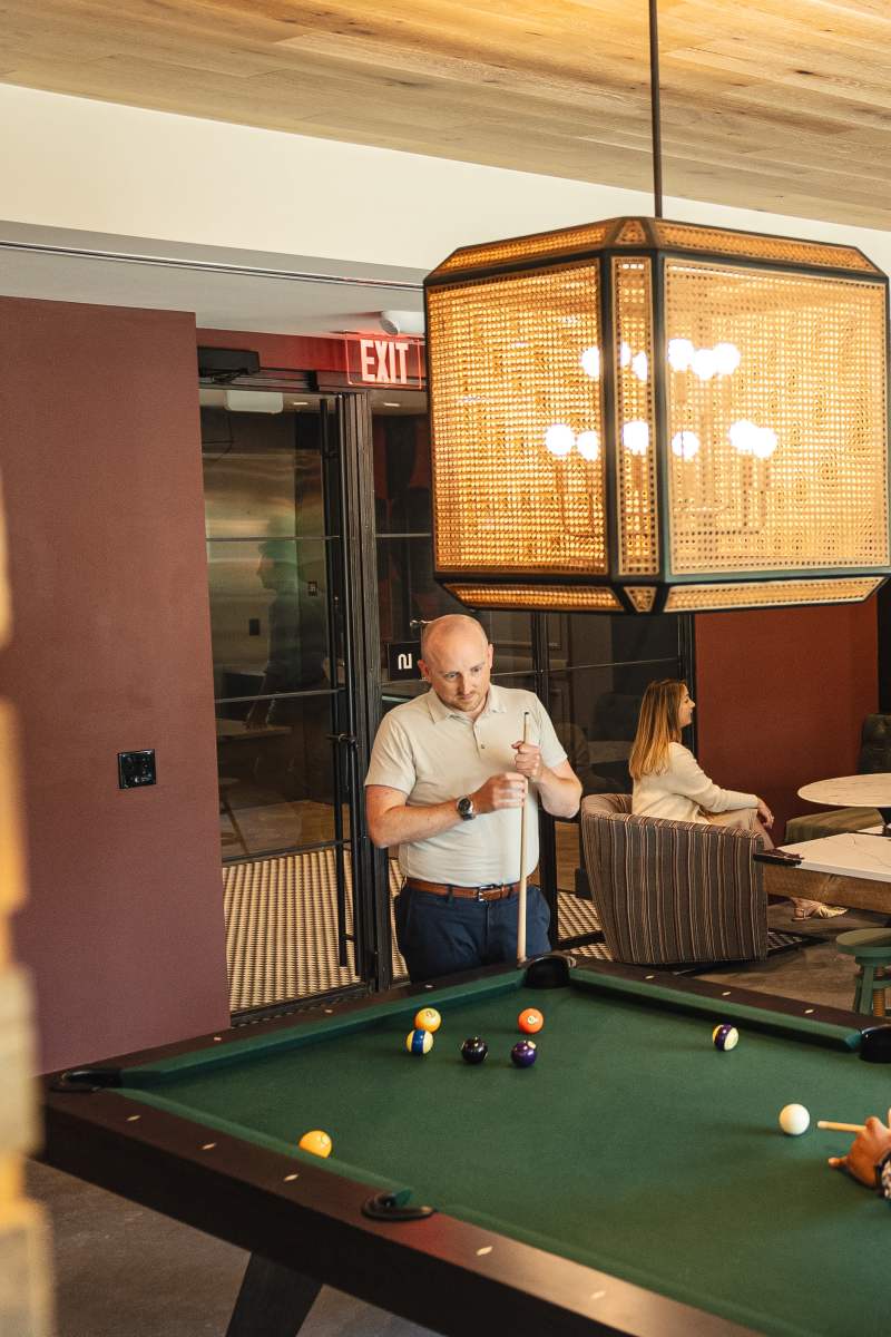 Resident playing pool at Channel House in Raleigh, North Carolina