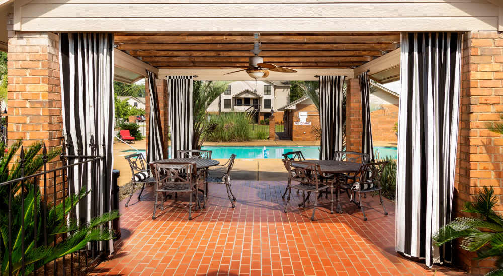 Resort-style swimming pool with cabana at The Arbors On Taylor in Montgomery, Alabama
