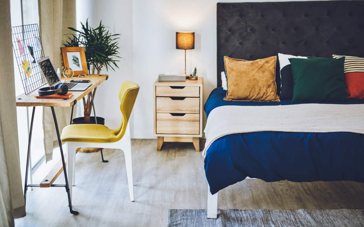 Bedroom with wooden flooring at Ivey Ridge Apartments in Graham, North Carolina