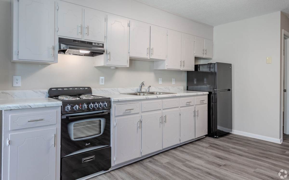 Kitchen with wood flooring at Ramsey Pines in Fayetteville, North Carolina