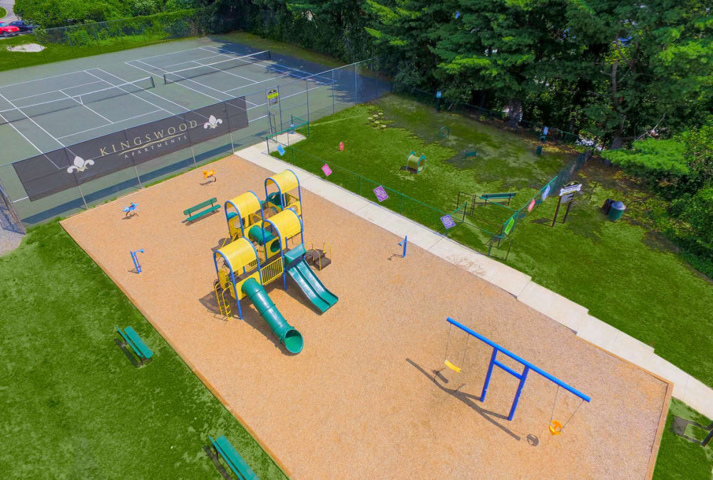 Aerial view of the playground, tennis court, and dog park at Kingswood Apartments & Townhomes in King of Prussia, Pennsylvania