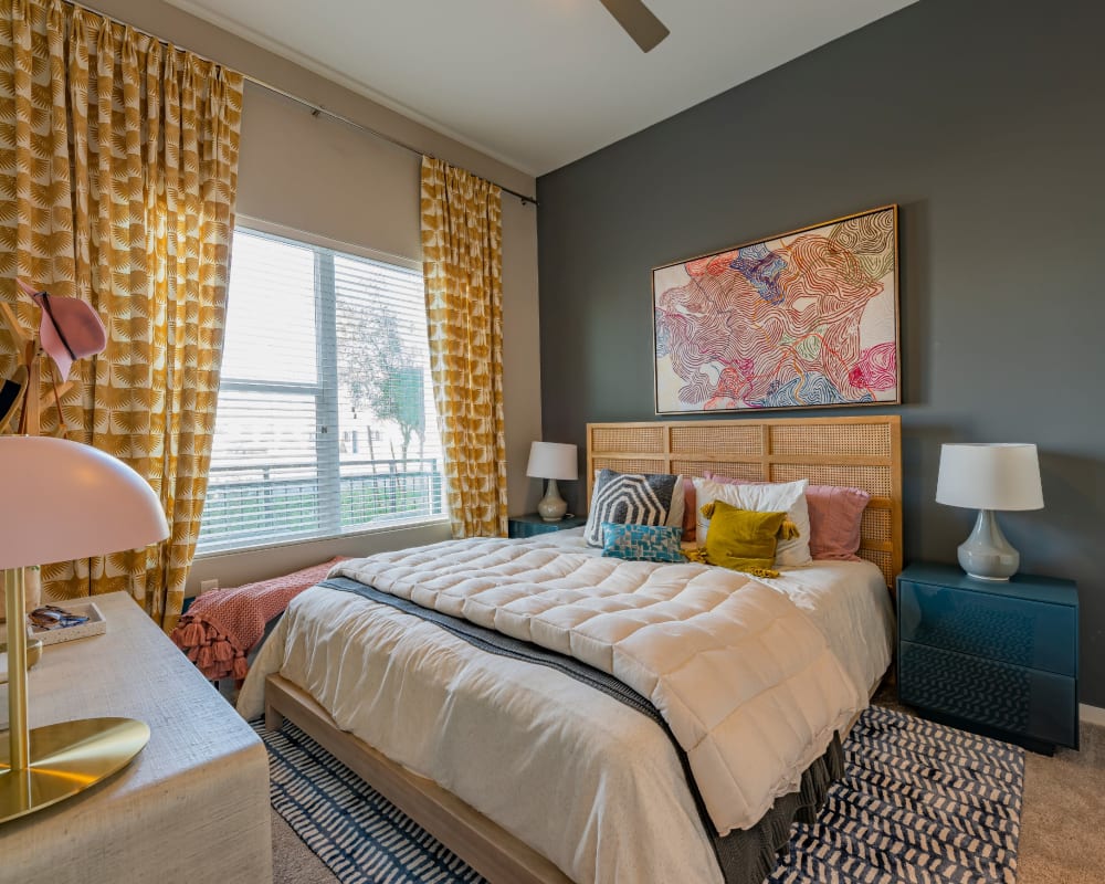 Bright bedroom with a ceiling fan at Encore Tessera in Phoenix, Arizona