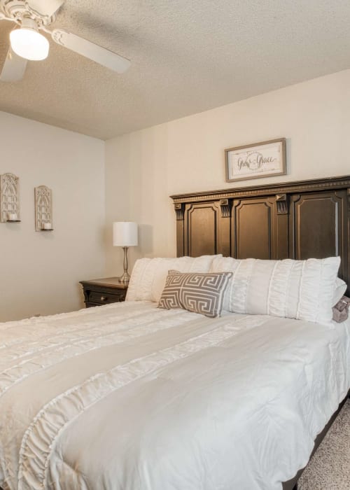 Bedroom with plush carpeting at Hunters Glen in Killeen, Texas