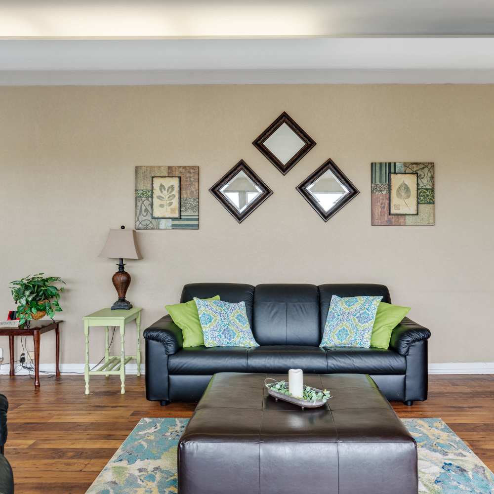Couch with wooden flooring at Germantown Gardens in East Ridge, Tennessee