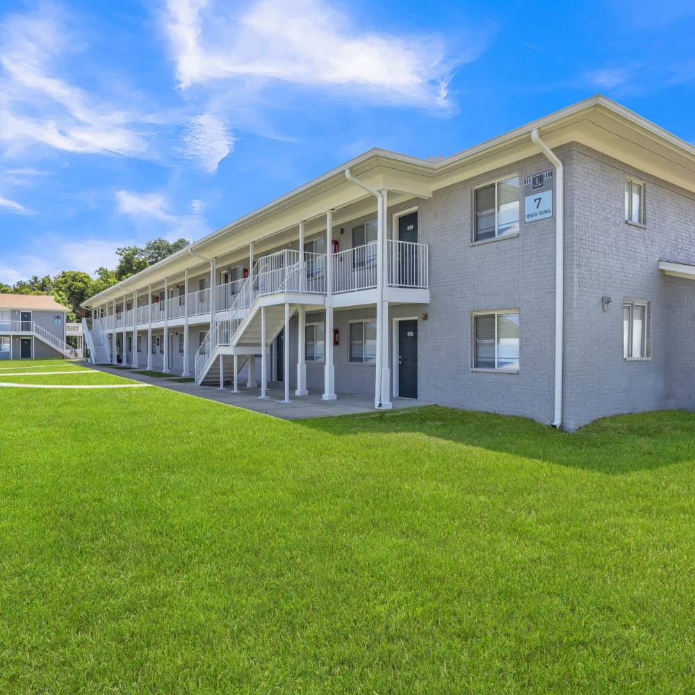 Exterior view with greenspace at The Laurel in Pensacola, Florida