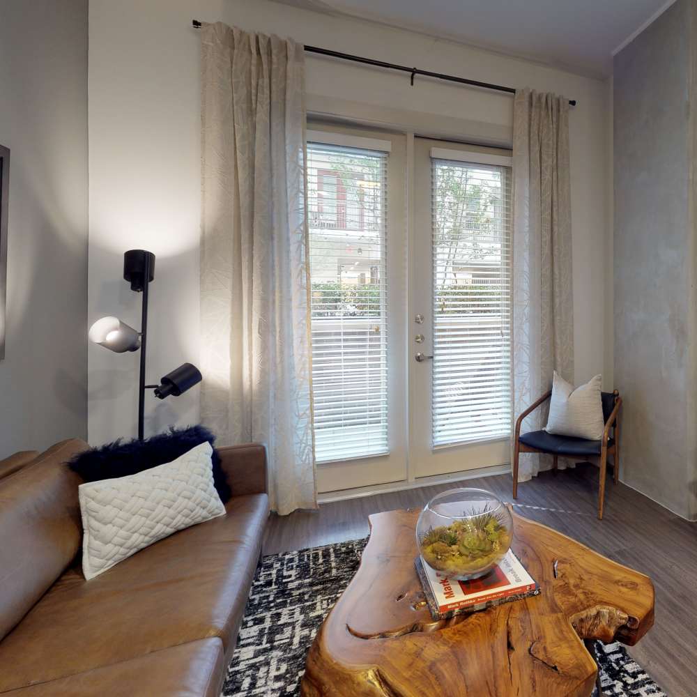 Living room with close access to patio at Howell Uptown in Dallas,Texas