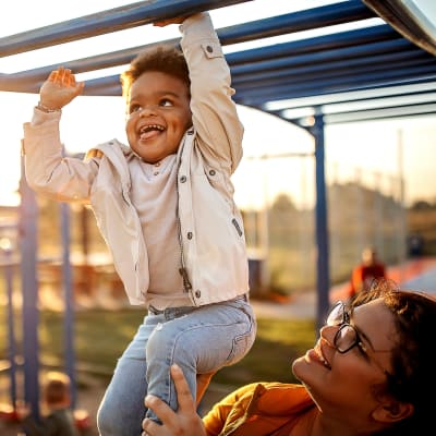 Kid playing on playground at Creekside Corners in Lithonia, Georgia