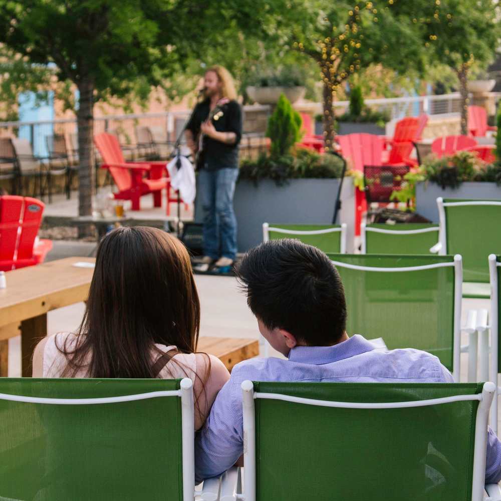 Residents chilling in local restaurant near Pike West Commerce in Dallas, Texas