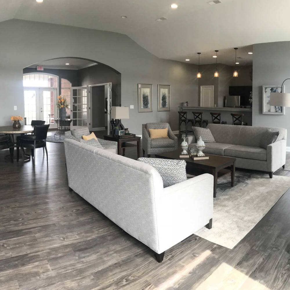 Resident community living space with wood style flooring at Lakeshore Apartment Homes in Evansville, Indiana