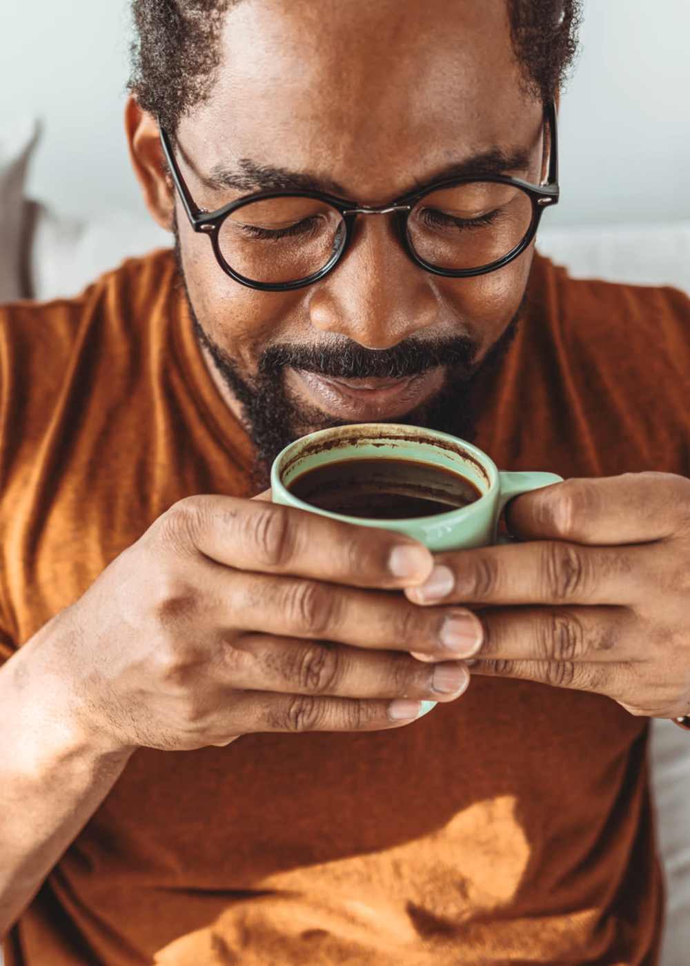 A resident man having coffee at Cottages at Craft Farms in Gulf Shores,Alabama