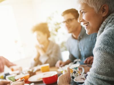 Residents and visitors gather for a party at Hudson Oaks Active Adult Living in Bryan, Texas