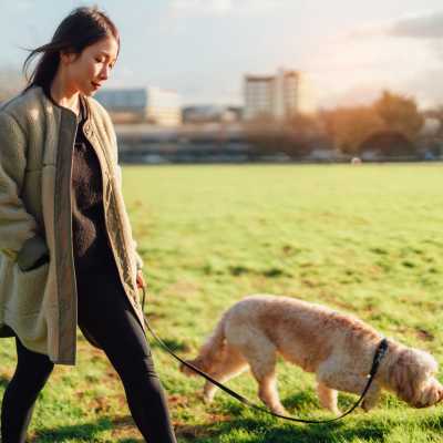 Women going for a walk with her pet at Legacy Ridge in Atlanta, Georgia