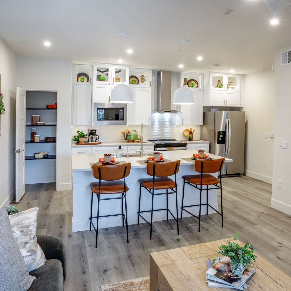 Living room with center table and view to kitchen at Night Fall in Las Vegas. NV