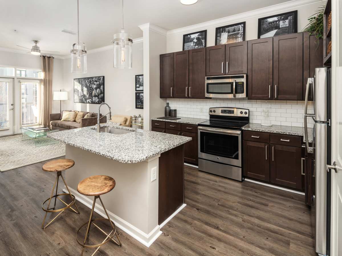 Luxury living room with large windows and couch at Ardmore & Twenty Eighth in Atlanta, Georgia