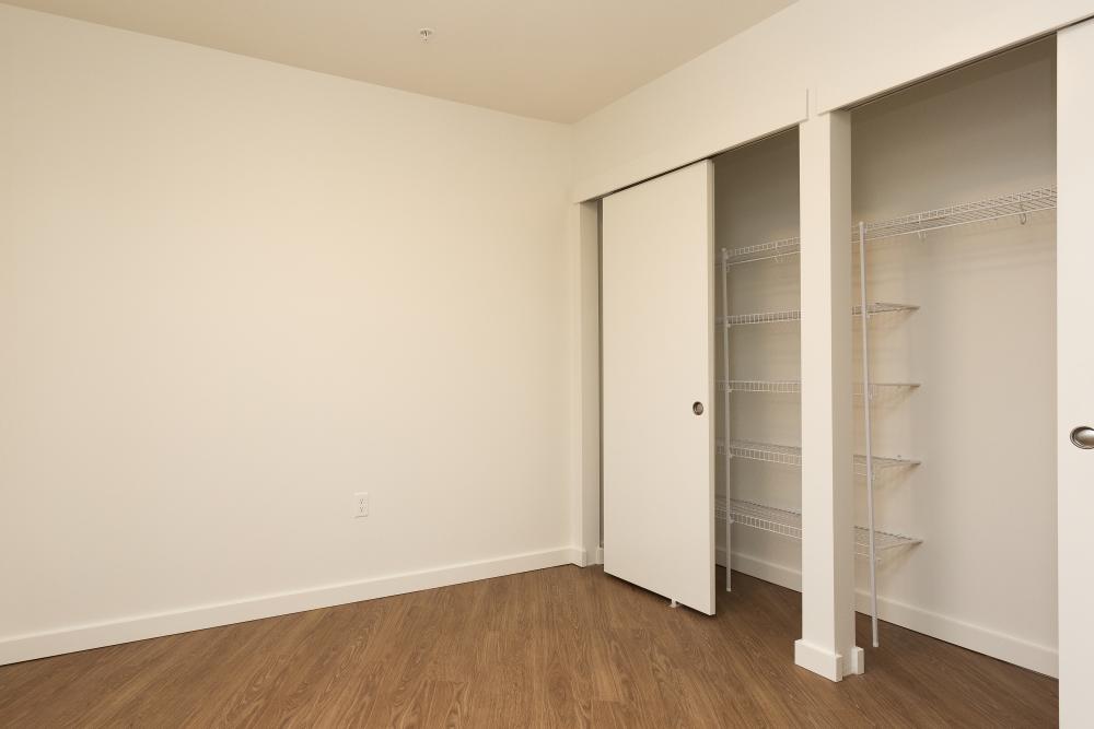 Apartment bedroom with closets at Gardner House in Seattle,Washington
