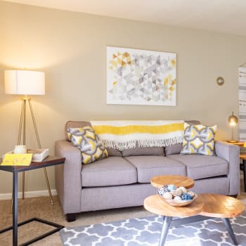 A beautifully furnished living room in a model home at Columbus Park Apartments in Bedford Heights, Ohio