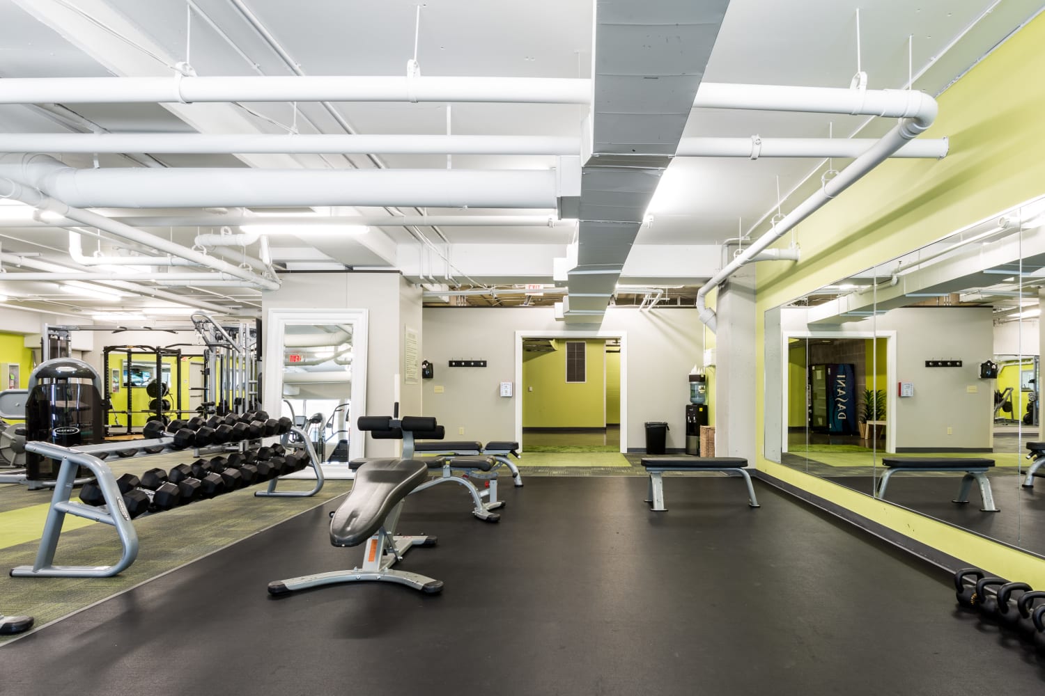 Fitness center with plenty of workout stations at The Heights at Park Lane in Dallas, Texas