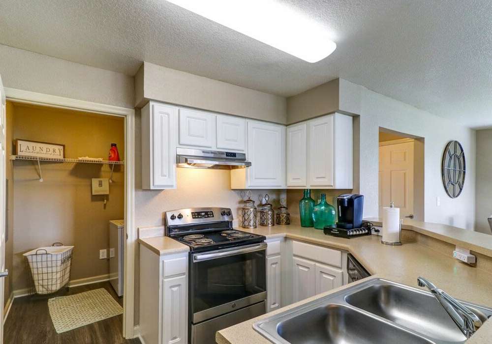 Modern kitchen with stainless steel appliances at The Reserve at Kanapaha in Gainesville, Florida