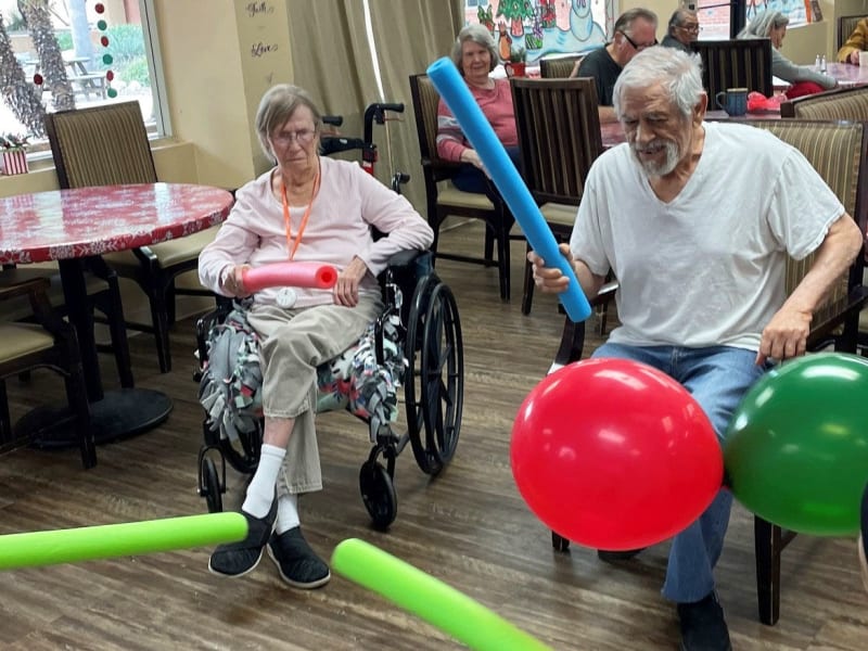Elderly residents playing at the event at {location_name}} in Tucson, Arizona