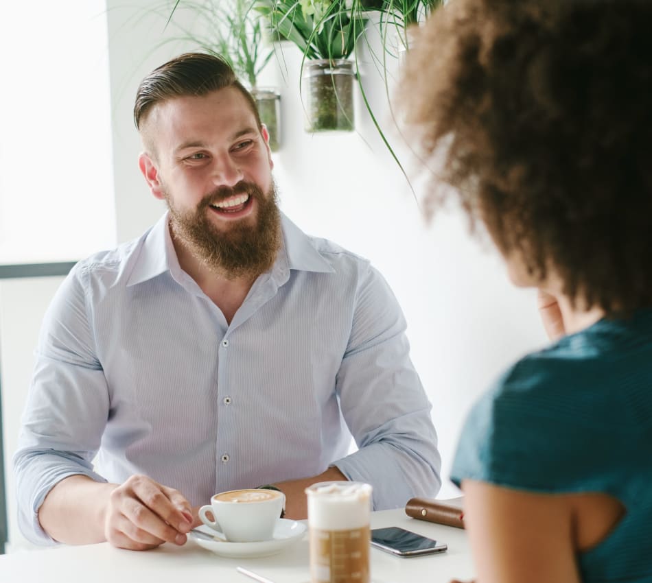 Resident discussing a project with a colleague outside their office near Vue Issaquah in Issaquah, Washington