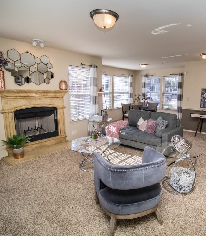 Carpeted living room at Tuscany Place in Lubbock, Texas