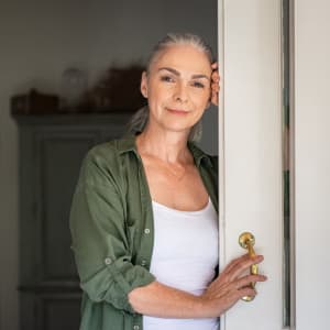 Woman leaning against door at The Spring at Silverton in Fort Worth, Texas