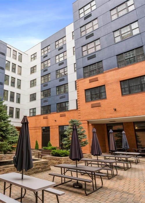 Courtyard with picnic tables at Parc at Lyndhurst in Lyndhurst, New Jersey