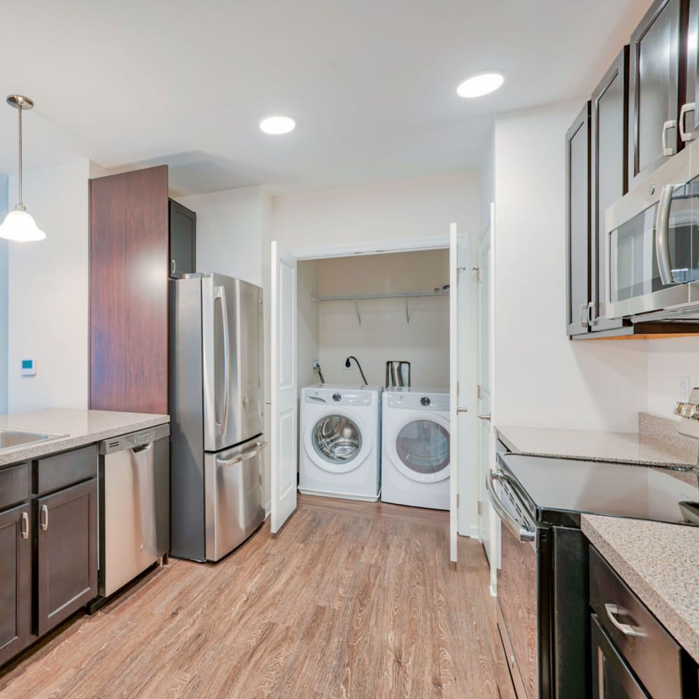 Kitchen with laundry closet and in-unit washer and dryer at Evergreen, Monroeville, Pennsylvania