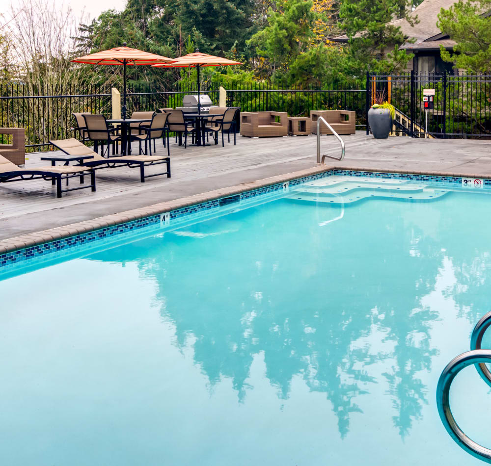 Shaded seating near the pool at Sofi at Somerset in Bellevue, Washington