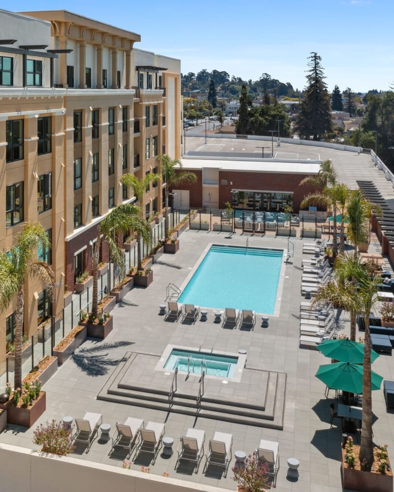 Aerial view of the building and outdoor swimming pool at Lincoln Landing in Hayward, California