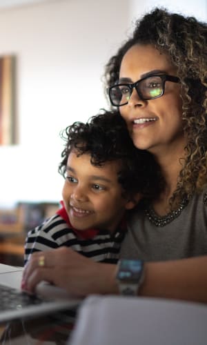 Resident working from home with some help from her son at Vista Verde in Mesquite, Texas