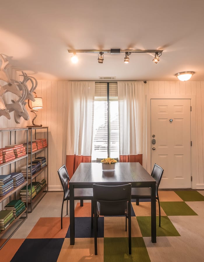 Study space with a bookshelf and warm lighting at The Thompson in San Marcos, Texas