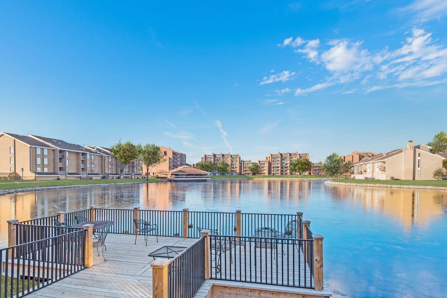 Pier and view of Regency Lakeside Apartment Homes across the lake in Omaha, Nebraska