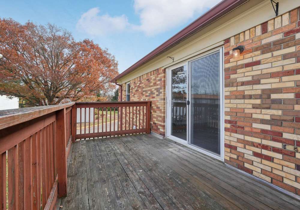 Private balcony with sliding door access to living at Charleston Square Apartments in Columbus, Indiana