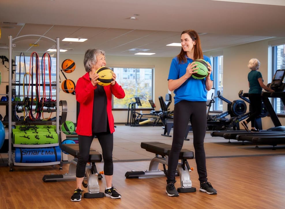 Resident working out with employee at Murano in Seattle, Washington