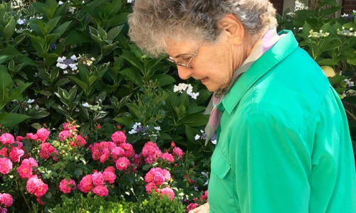 A resident in the garden at a Merrill Gardens community.