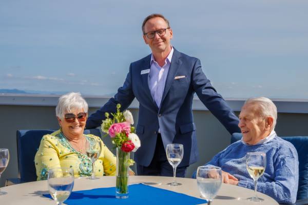 General Manager with residents on deck