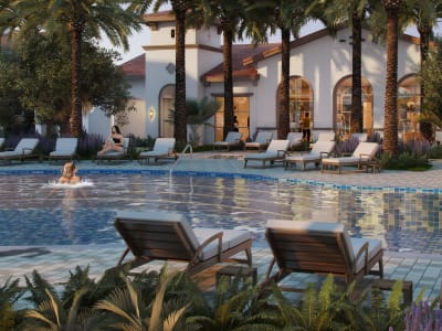 Resort-style swimming pool surrounded by lush landscaping at The Villas at Anacapa Canyon in Camarillo, California