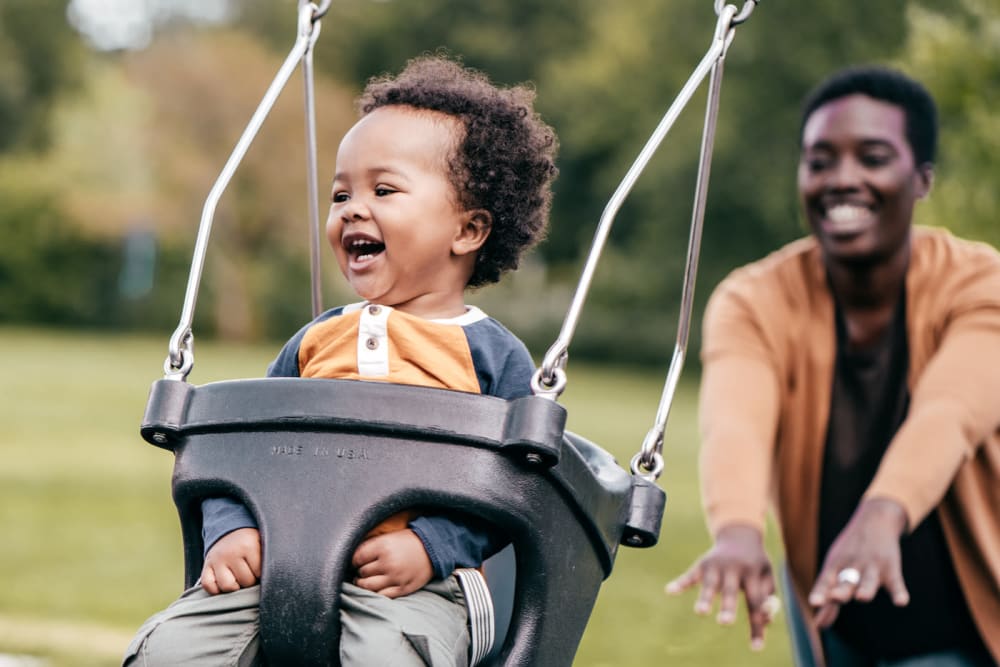 A women at the park with her child at 770 C Street Apartments in Washington, District of Columbia