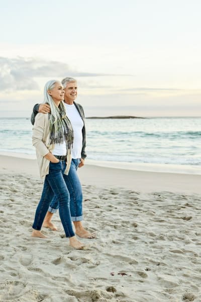 Residents walk on the beach near Bay on 6th, Santa Monica, California