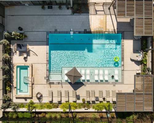 Aerial view of swimming pool with sundecks along with kids pool at Clovis Point in Longmont, Colorado
