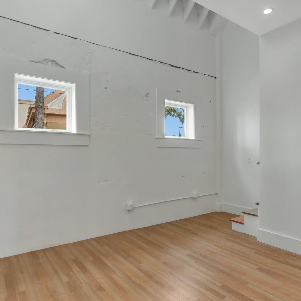 Un furnished area with wooden flooring near stairs at 189 Barksdale in Memphis, Tennessee