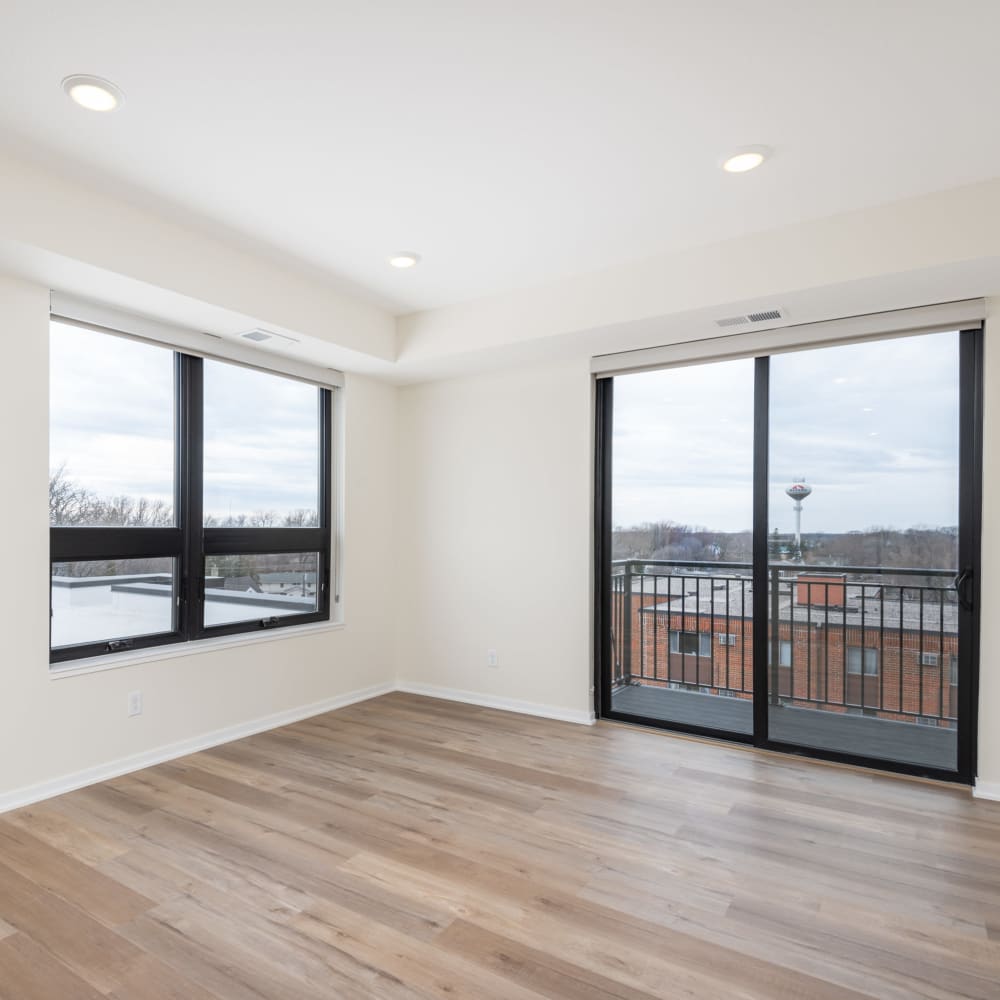 Unfurnished living area with access to balcony at The Uptown Apartments in Waconia, Minnesota